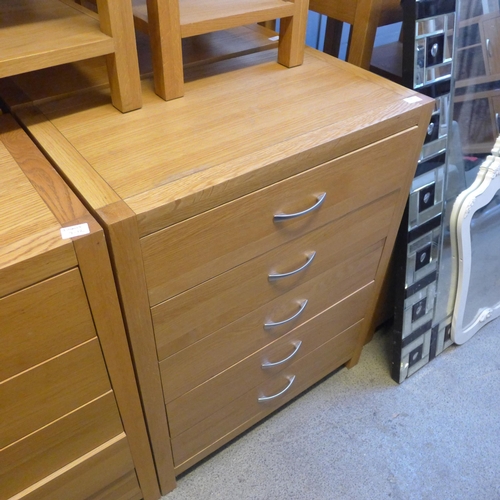 1658 - An oak five drawer chest * this lot is subject to VAT