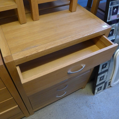 1658 - An oak five drawer chest * this lot is subject to VAT