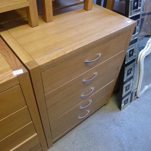 1659 - An oak five drawer chest * this lot is subject to VAT