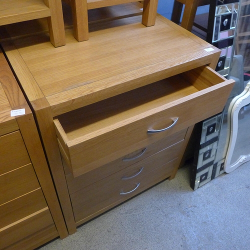 1659 - An oak five drawer chest * this lot is subject to VAT