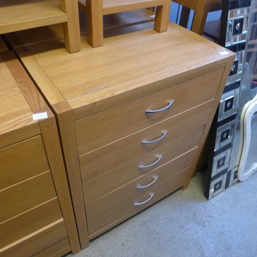 1660 - An oak five drawer chest * this lot is subject to VAT