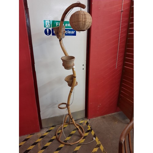 55 - A bamboo snake shaped floor standing lamp/plant stand