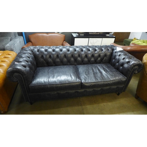 1301 - A 'Historian' Hobnail liquorice distressed leather upholstered Chesterfield style three seater sofa ... 