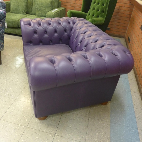 1350 - An Alfie Indigo leather upholstered Chesterfield style love seat , RRP £2400* this lot is subject to... 