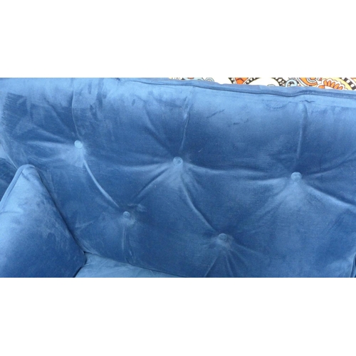 1431 - A blue velvet Hoxton three seater sofa - RRP £799