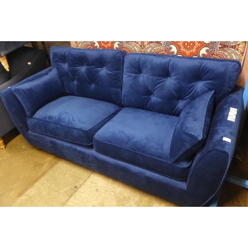 1432 - A blue velvet Hoxton three seater sofa - RRP £799