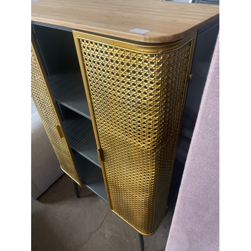 1414 - A gold rattan effect industrial style cabinet