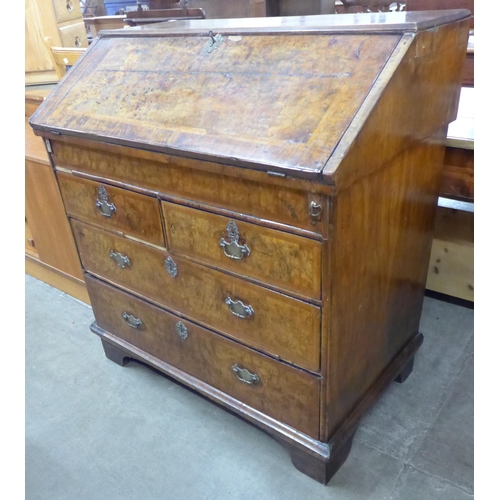 104 - A Queen Anne figured walnut bureau