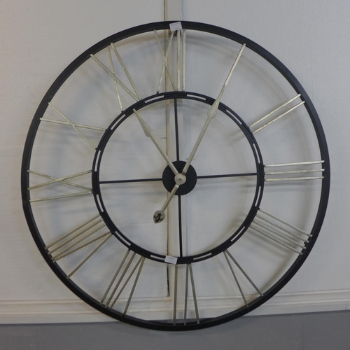 1322 - A large black skeleton clock with gold numerals