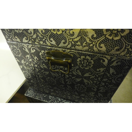 1348 - A set of three metal patterned storage trunks