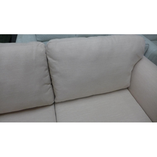 1385 - A candy floss fabric upholstered three seater sofa