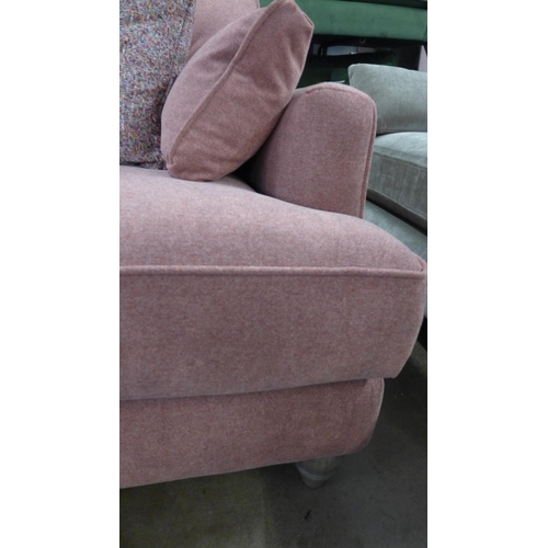 1407 - A pair of raspberry velvet upholstered two seater sofas with multi coloured scatter cushions