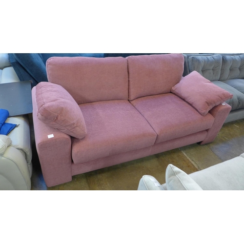 1415 - A Raspberry textured velvet upholstered three seater sofa