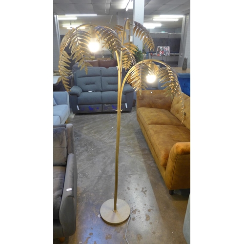 1418 - A gold floor standing fern lamp