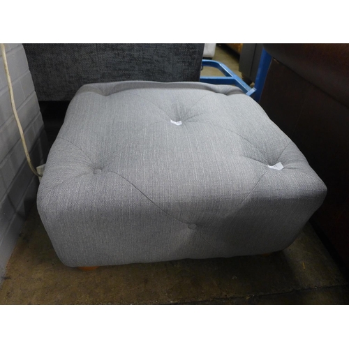 1423 - A grey textured weave, buttoned footstool