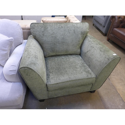 1450 - A moss green textured velvet upholstered oversized armchair