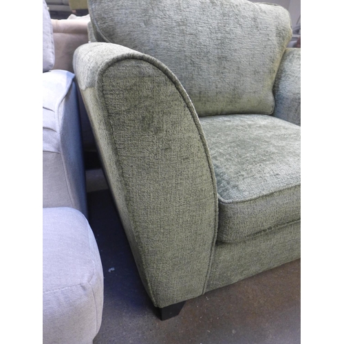 1450 - A moss green textured velvet upholstered oversized armchair