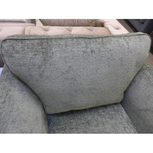 1450 - A moss green textured velvet upholstered oversized armchair