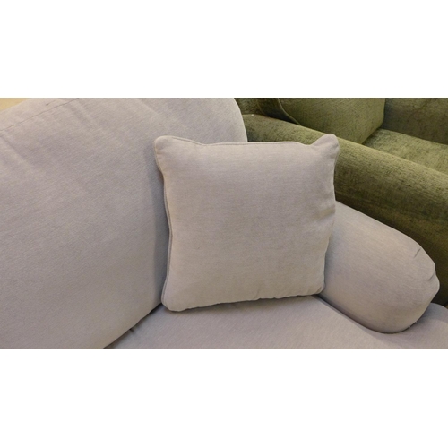 1451 - A light grey velvet upholstered large three seater sofa