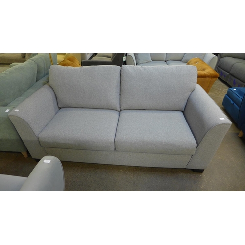 1454 - A mid grey fabric upholstered 2.5 seater sofa