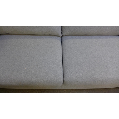 1454 - A mid grey fabric upholstered 2.5 seater sofa