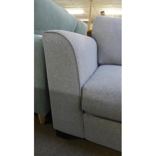 1454 - A mid grey fabric upholstered 2.5 seater sofa