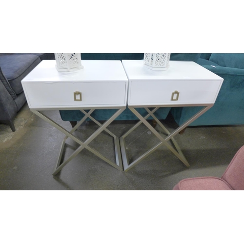 1457 - A pair of white bedside tables with cross legs