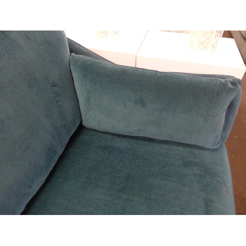 1460 - A Luna teal velvet upholstered three seater sofa on dark turned oak legs