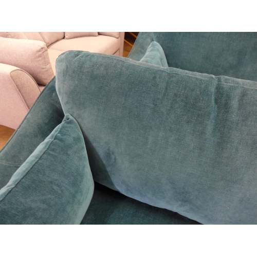 1460 - A Luna teal velvet upholstered three seater sofa on dark turned oak legs