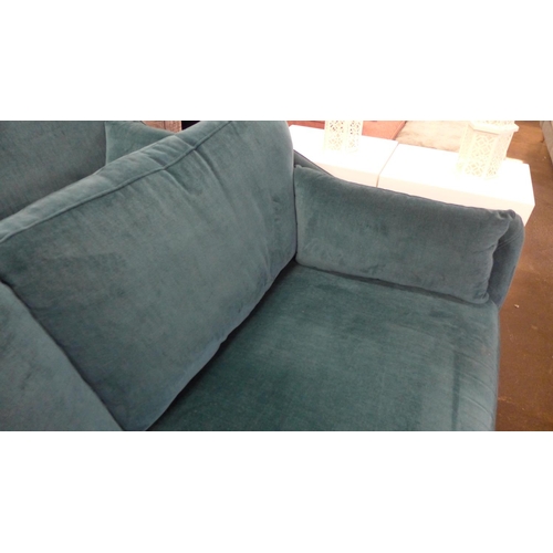 1461 - A Luna teal velvet upholstered three seater sofa on dark turned oak legs