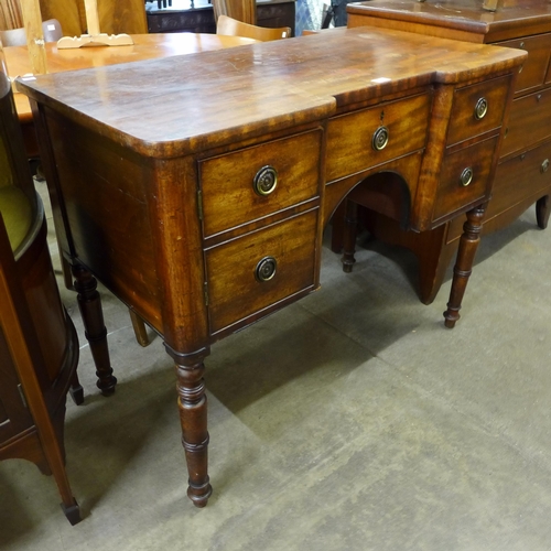 173 - A George III inverted breakfront mahogany sideboard