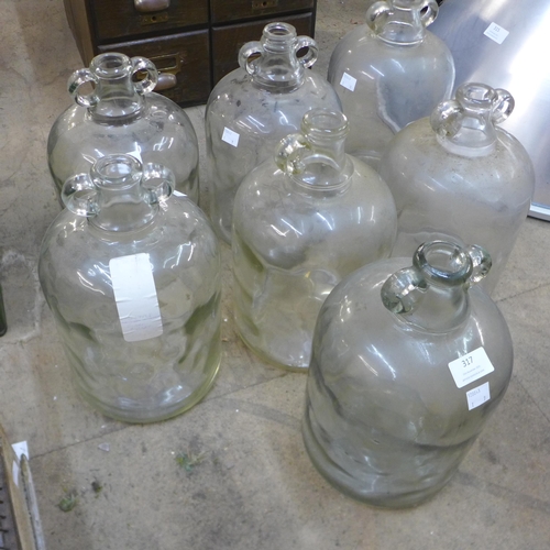 281 - A set of six glass demi-Johns and another