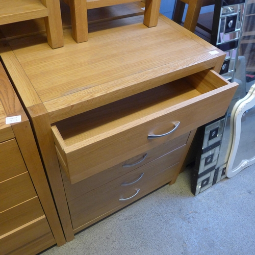 1629 - An oak five drawer chest * this lot is subject to VAT