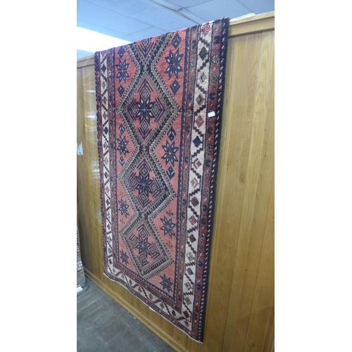 1484 - A washed red ground full pile Persian hamadan runner, 295cm x 107cm