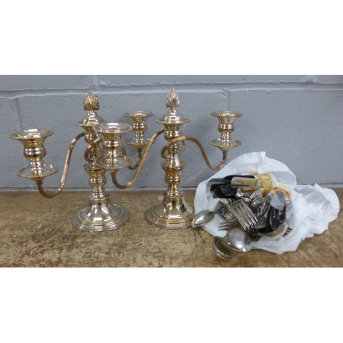 1169 - Two plated candelabra and a collection of plated cutlery **PLEASE NOTE THIS LOT IS NOT ELIGIBLE FOR ... 