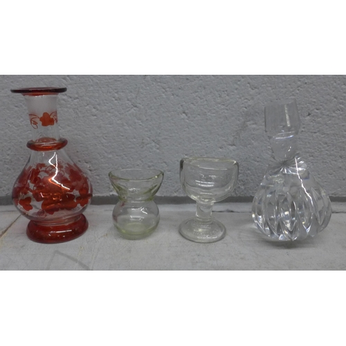 1183 - A collection of glassware including colourd glass and two eye baths, a cut crystal decanter with thr... 