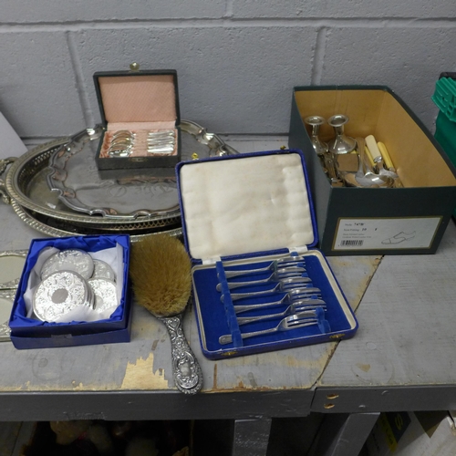 1187 - A box of silver plate and pewter including two trays, salver, cased forks, wine coaster, etc., and a... 