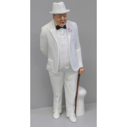 612 - A Royal Doulton figure, The Old Balloon Seller and Sir Winston Churchill, Churchill a/f