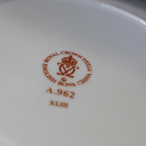 617 - Six Royal Crown Derby plates including three Royal Commemoratives; four with wavy edge