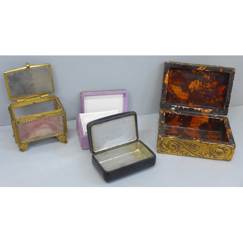 633 - A papier mache snuff box set with abalone, a small gilt metal jewellery casket and two other boxes