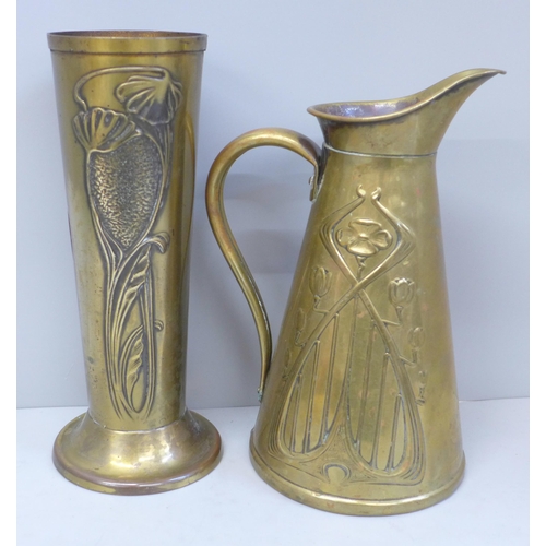 639 - An Art Nouveau small brass pitcher and a brass vase, 22cm