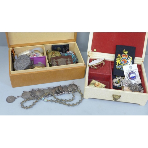 652 - Two boxes of trinket boxes, badges, jewellery, etc.