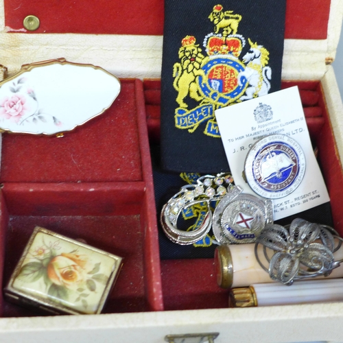 652 - Two boxes of trinket boxes, badges, jewellery, etc.