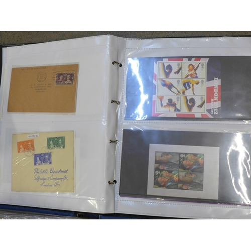 680 - An album of first day covers and some presentation packs, a £5 coin cover, an album of mixed stamps,... 