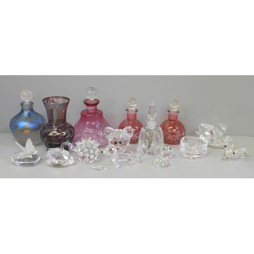 689 - Swarovski crystal animals, scent bottles, etc., including a pair of cranberry scents