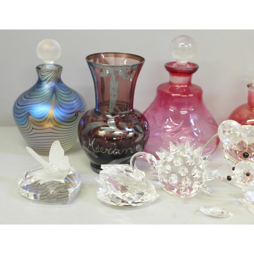 689 - Swarovski crystal animals, scent bottles, etc., including a pair of cranberry scents