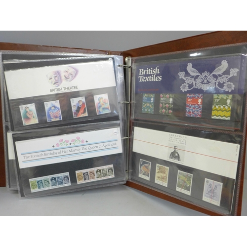 690 - Stamps; an album of GB presentation packs, 45 packs with a face value of over £120