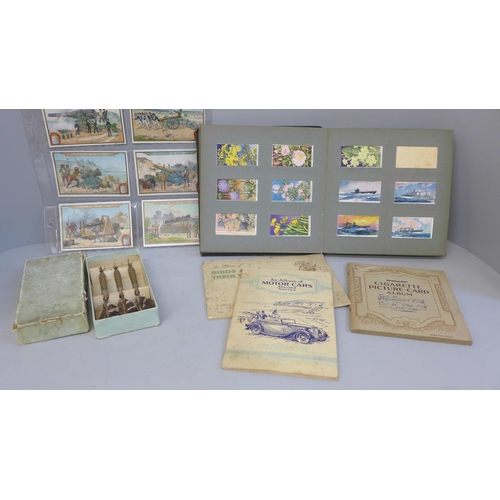 691 - A collection of cigarette cards, three albums