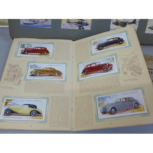 691 - A collection of cigarette cards, three albums