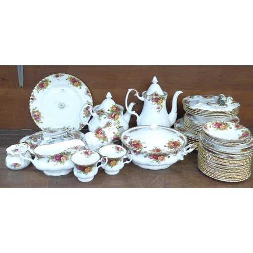 698 - Royal Albert Old Country Roses tea and dinnerwares, teapot, coffee pot, two cake stands, plates, bow... 